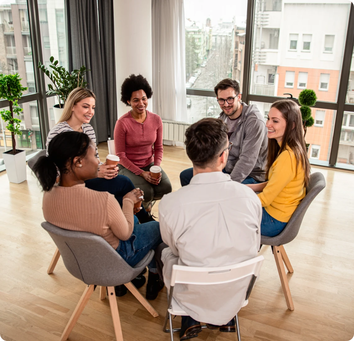 Casual meeting by large windows