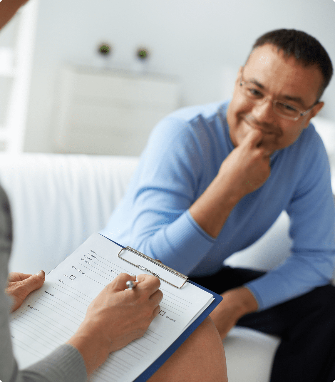 Man smiling during a counseling session